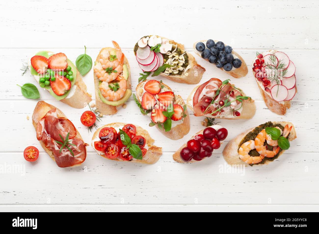 Appetizers board with traditional spanish tapas set. Italian antipasti  bruschetta snacks. Top view flat lay Stock Photo - Alamy