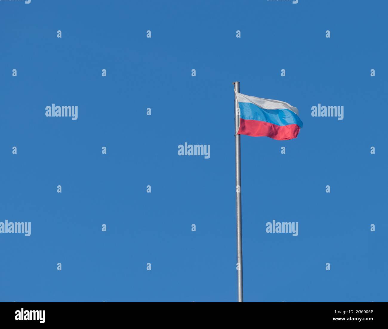 Russian flag against blue sky. Stock Photo