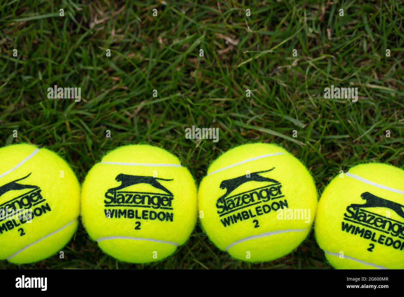 LONDON, UK - June 2021: Official wimbledon tennis Slazenger brand ball on grass Stock Photo