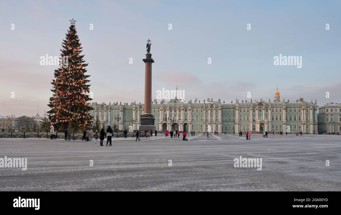 St. Petersburg, Russia, 16th January, 2021: People at the Christmas tree on Palace square against then Winter Palace and the Alexander Column Stock Photo