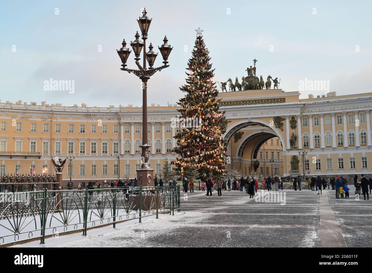 St. Petersburg, Russia, 16th January, 2021: People at the Christmas tree on Palace square against the arch of the General Staff building Stock Photo
