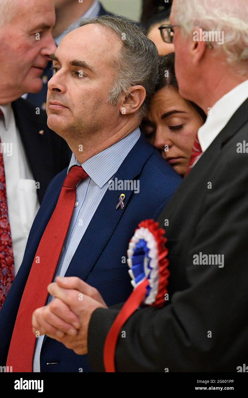 File photo dated 13/12/19 of DUP MLA Alex Easton as a supporter cries on  his shoulder as he watches his rival Stephen Farry of the Alliance Party  being elected in the North