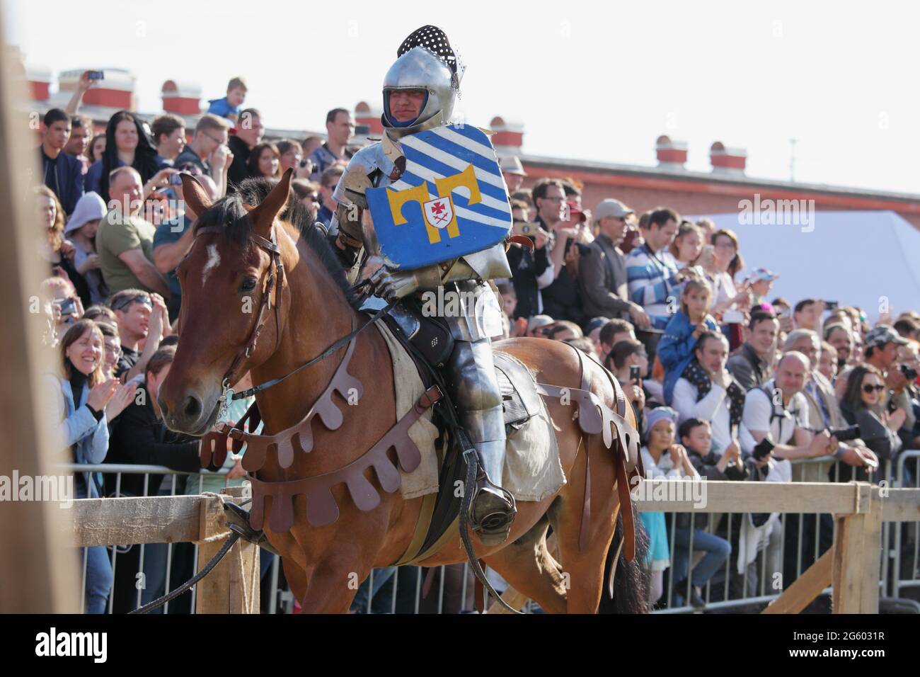 St. Petersburg, Russia - July 8, 2017: Armored knight on horse participating in the jousting tournament during the military history project Battle on Neva Stock Photo