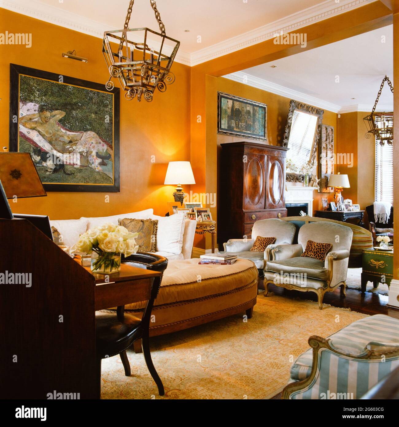 Vintage living room with lit lamp Stock Photo - Alamy