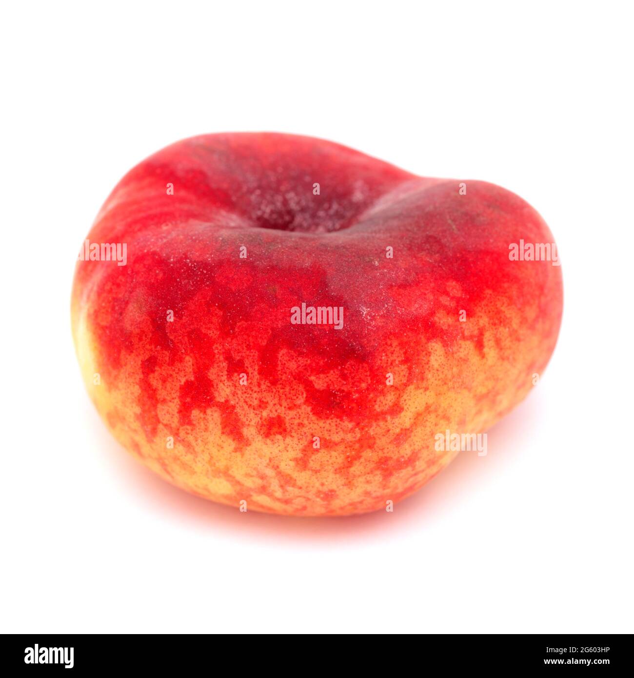 Large yellow and red flat peach fruit isolated on white background