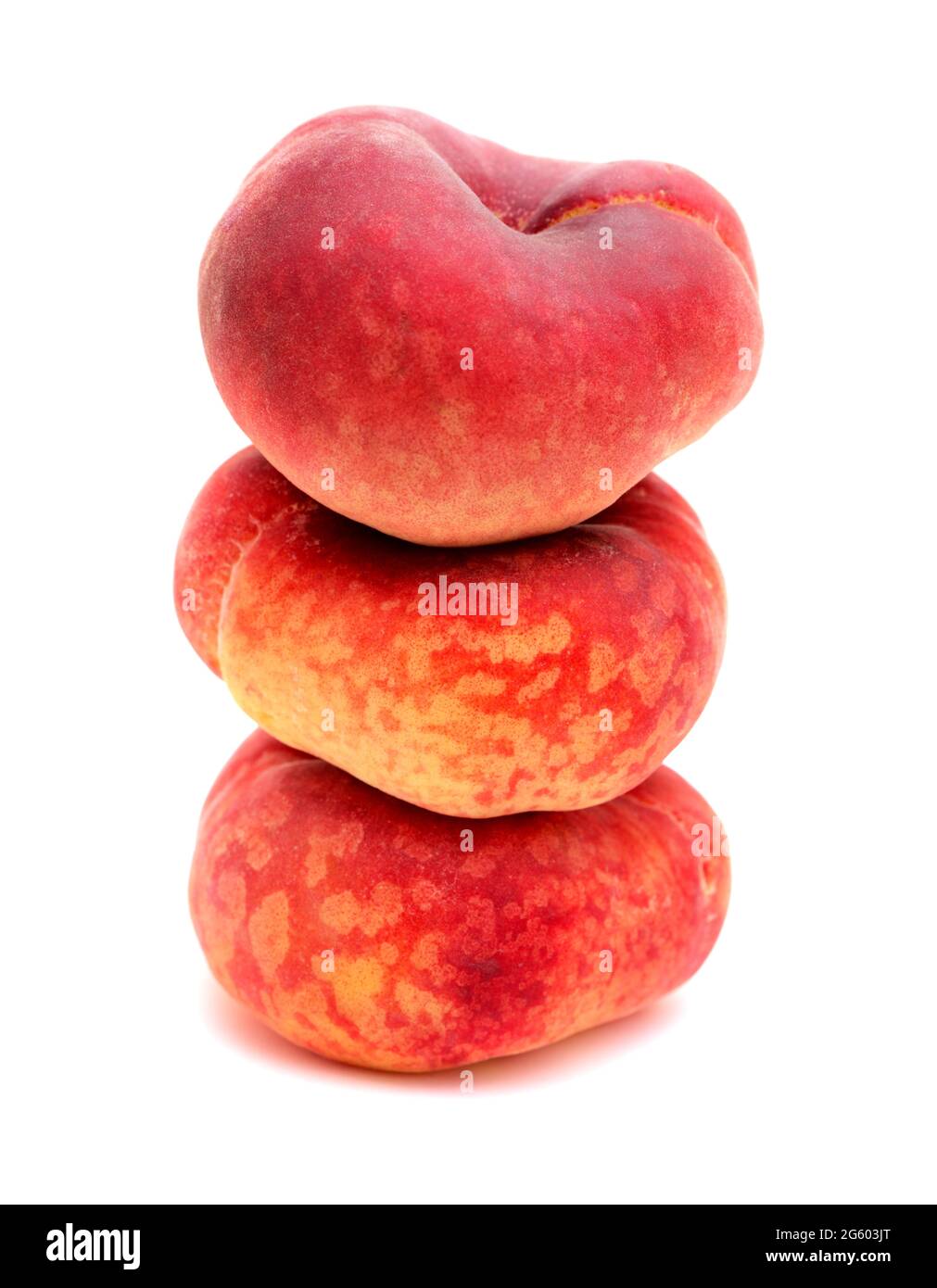 Large yellow and red flat peach fruit isolated on white background
