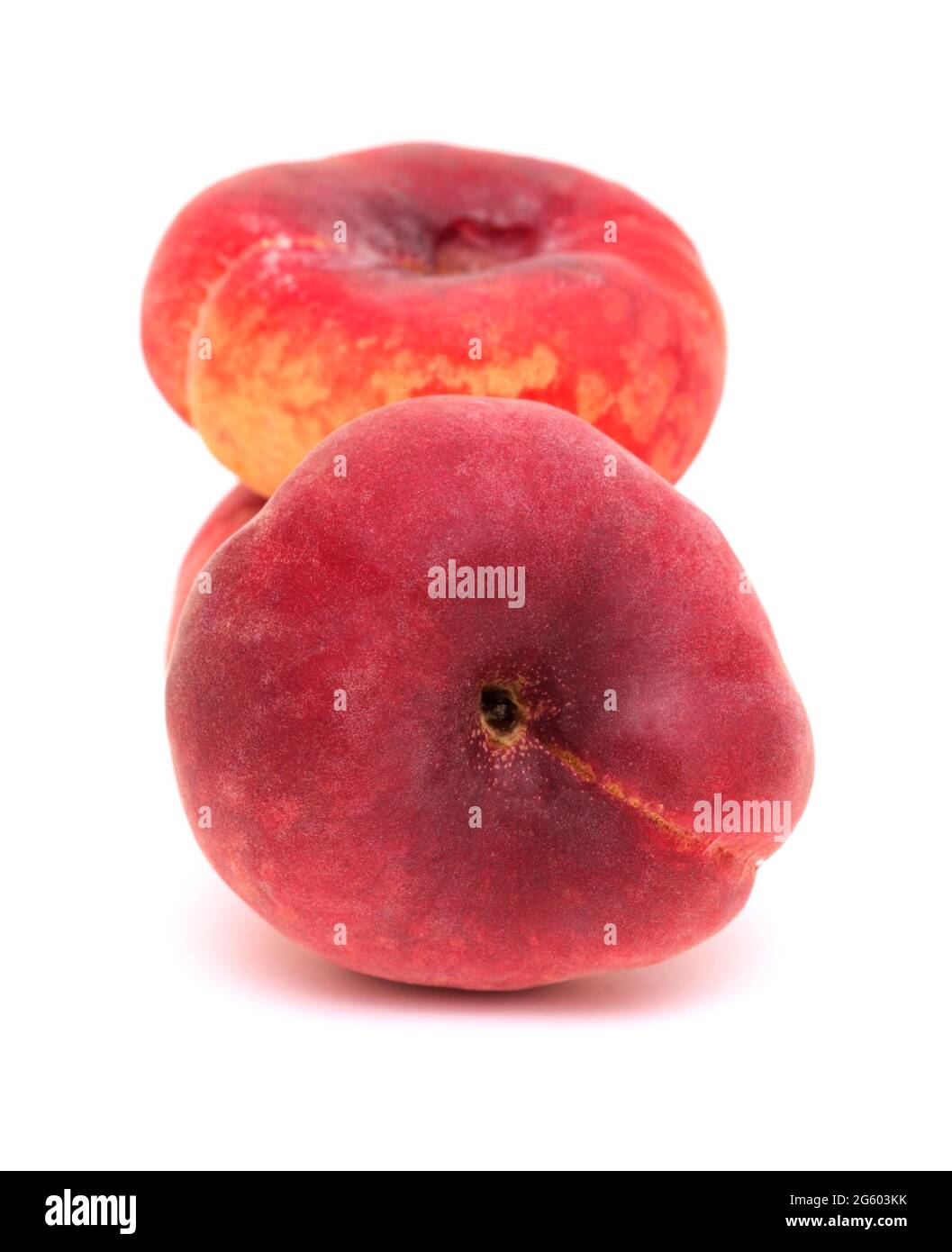 Large yellow and red flat peach fruit isolated on white background