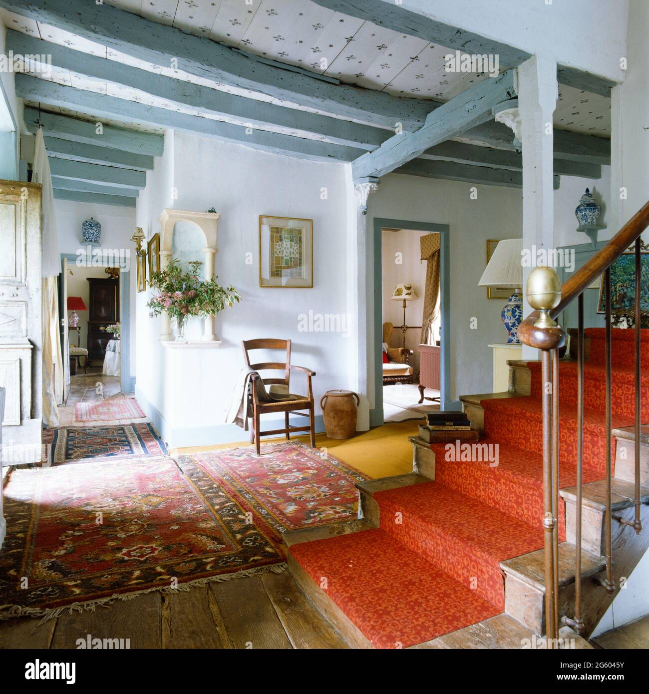 Red and blue rustic entrance hall Stock Photo - Alamy