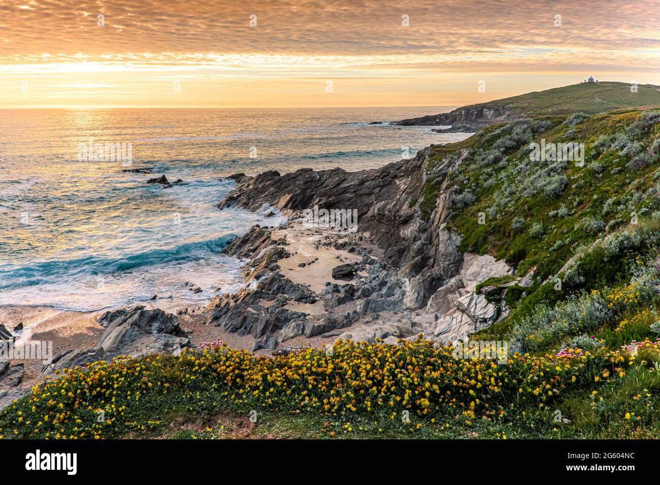 A spectacular sunset over the Celtic Sea seen from the coast of Newquay in Cornwall. Stock Photo