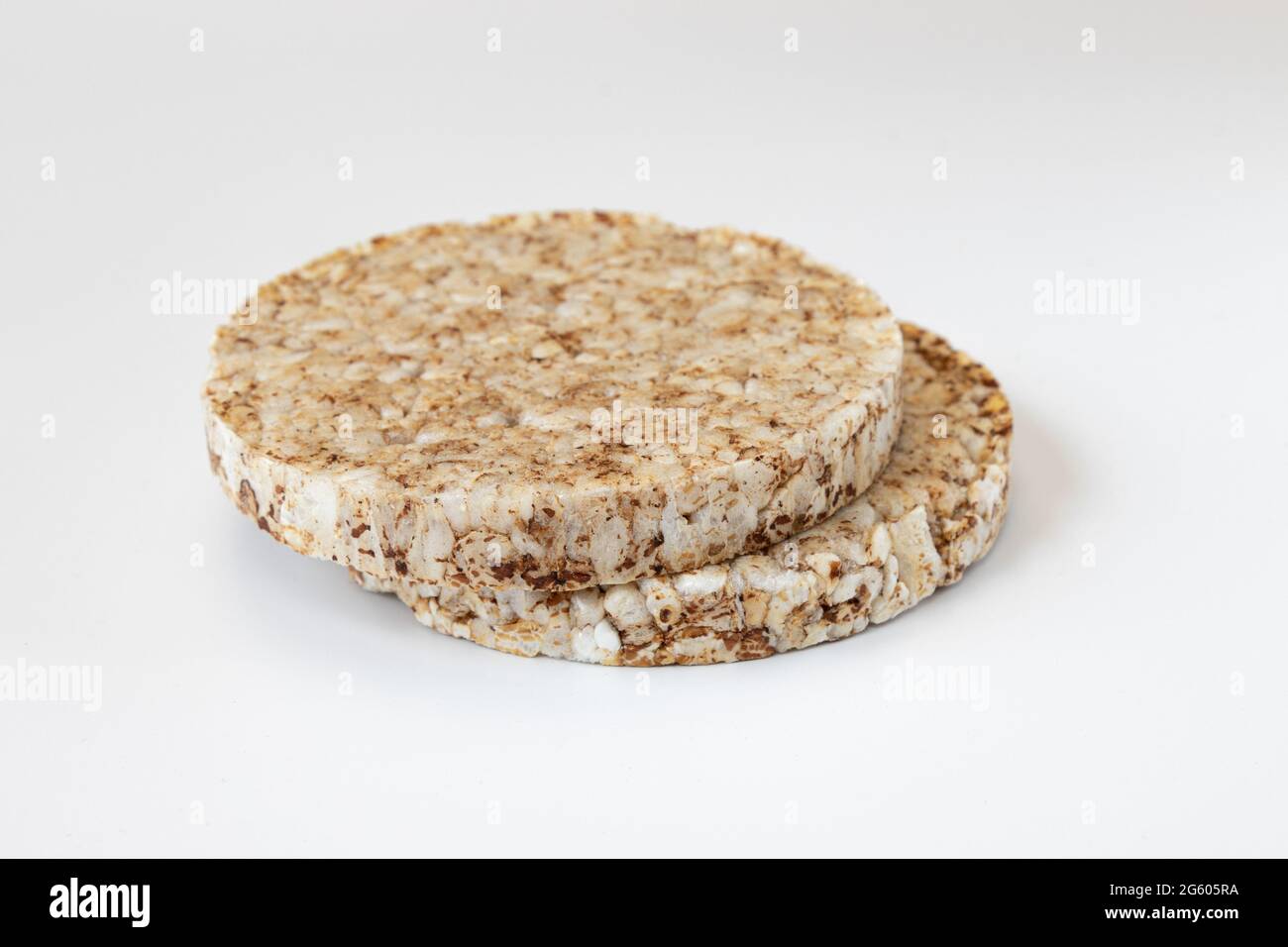 crunchy rice cakes on white background, two puffed whole grain crispbread and empty space for text isolated, close up Stock Photo