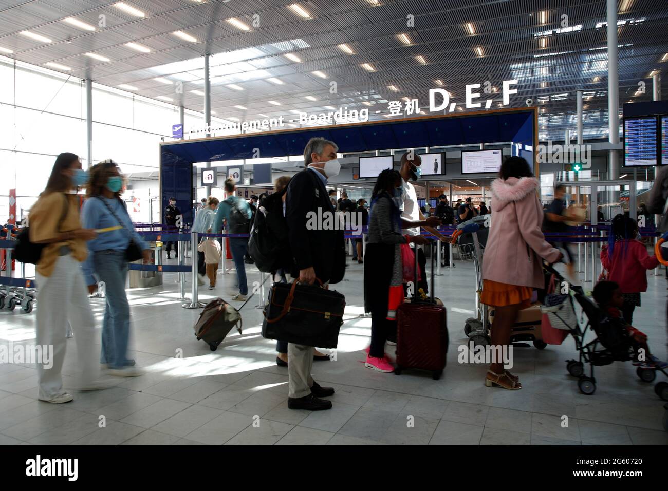 Passengers stand in a queue inside the Terminal 3 at Orly Airport, near  Paris, France, July 1, 2021. REUTERS/Sarah Meyssonnier Stock Photo - Alamy