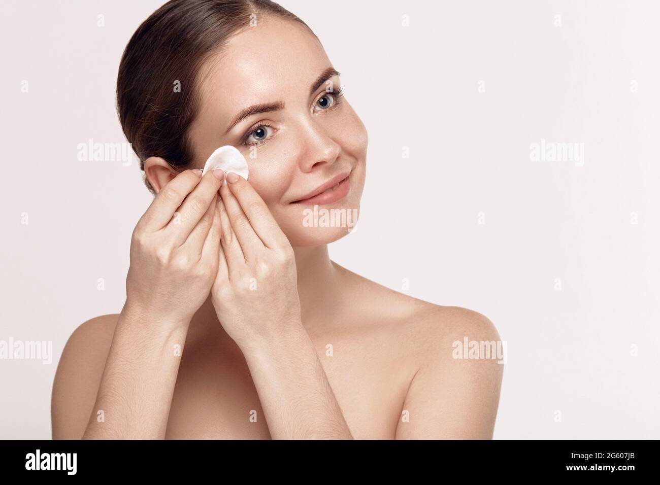 Woman taking off makeup hi-res stock photography and images - Alamy