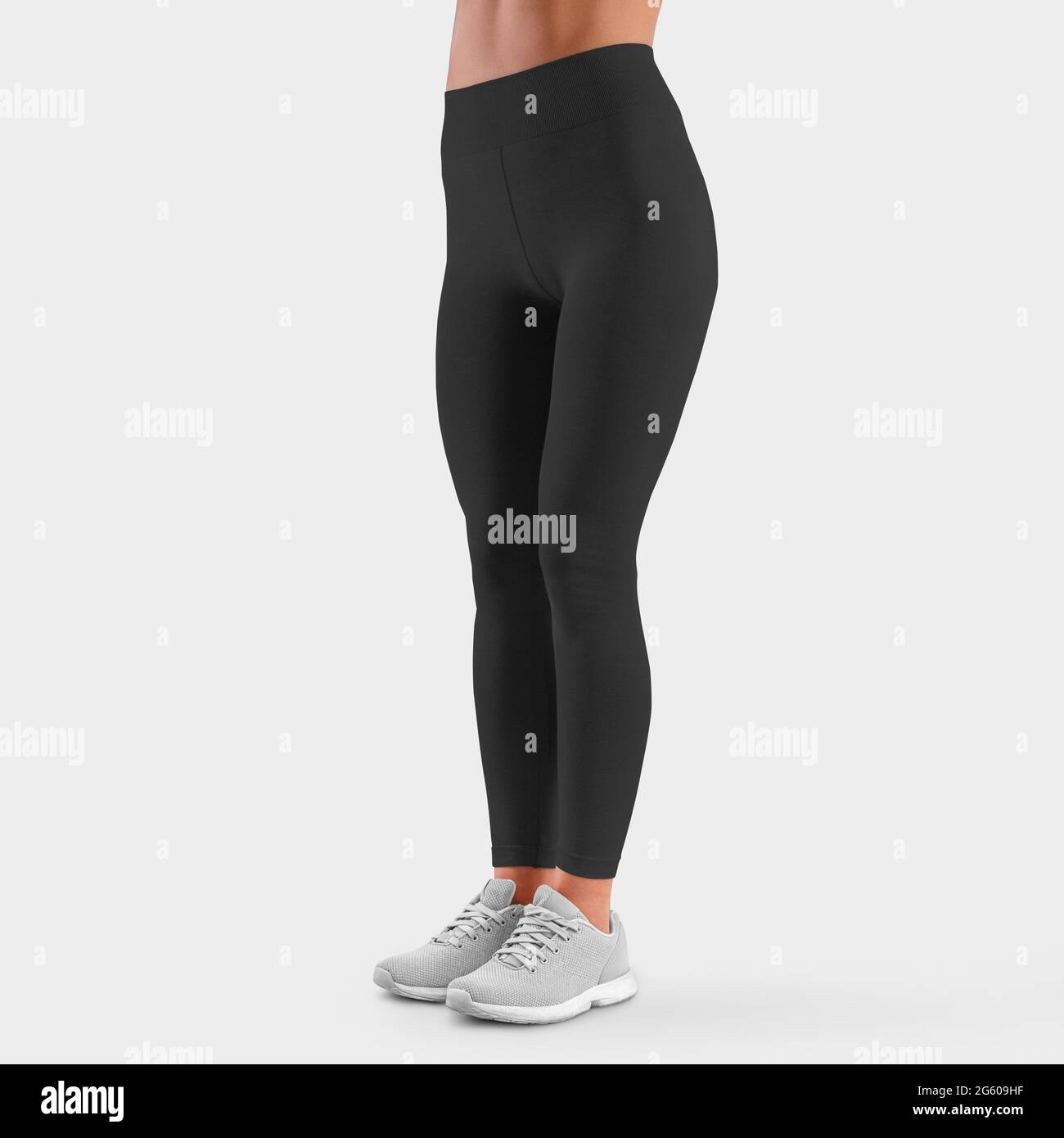 Mockup of stretch pants on the slender legs of a girl in sneakers, front  view, for presentation of design and pattern. Template trousers on a studio  b Stock Photo - Alamy
