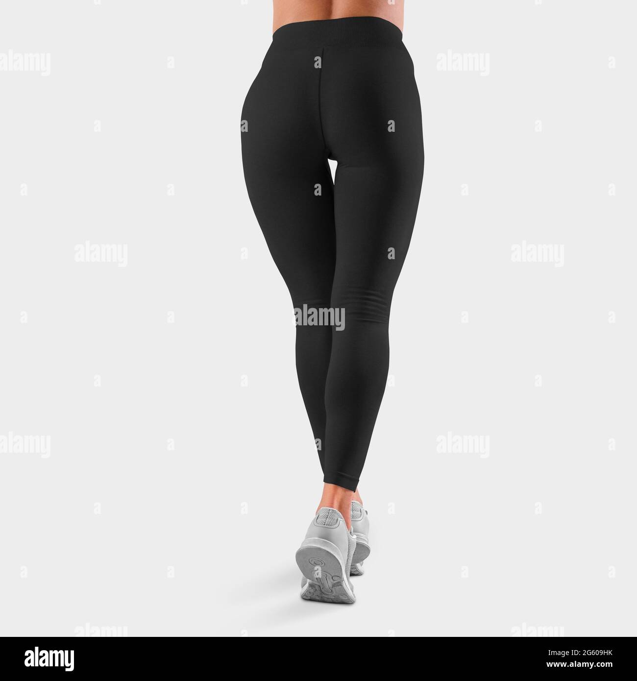 Mockup of black leggings on a girl standing with her back on toes, in the  background in the studio, posing. Tight-fitting pants template for design  pr Stock Photo - Alamy
