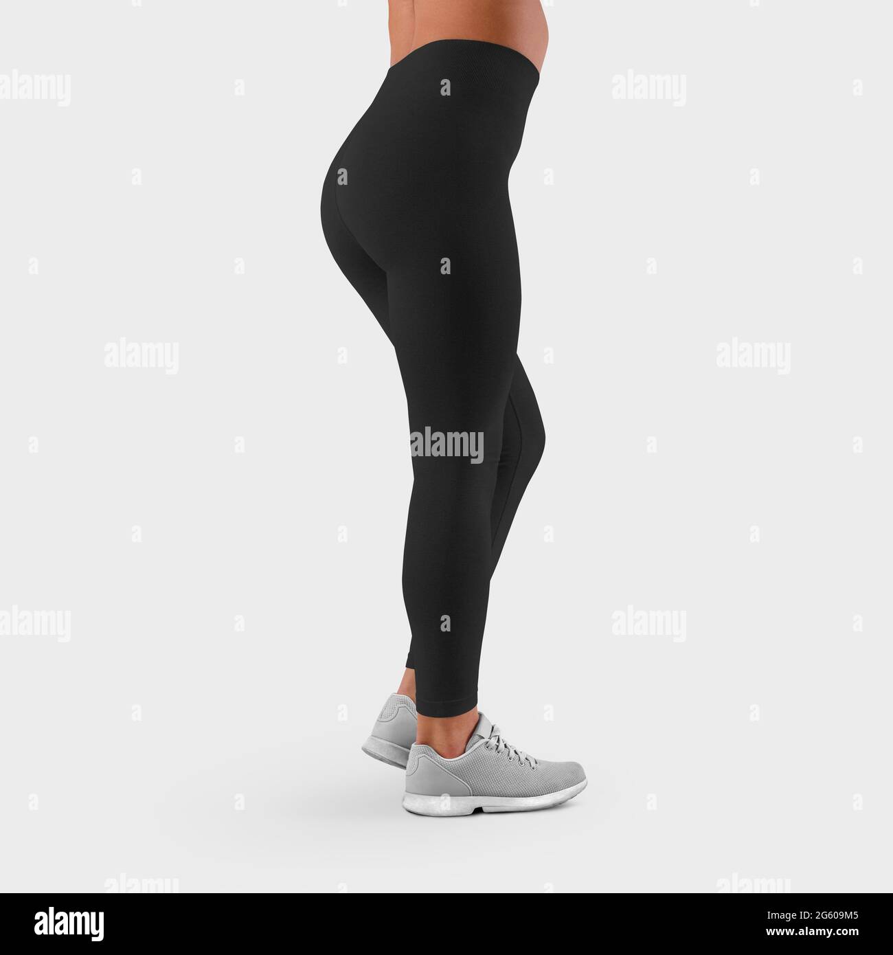 Mockup of sportswear on fit female legs, side view, empty black leggings for presentation of design and advertising in the online store. Template of t Stock Photo