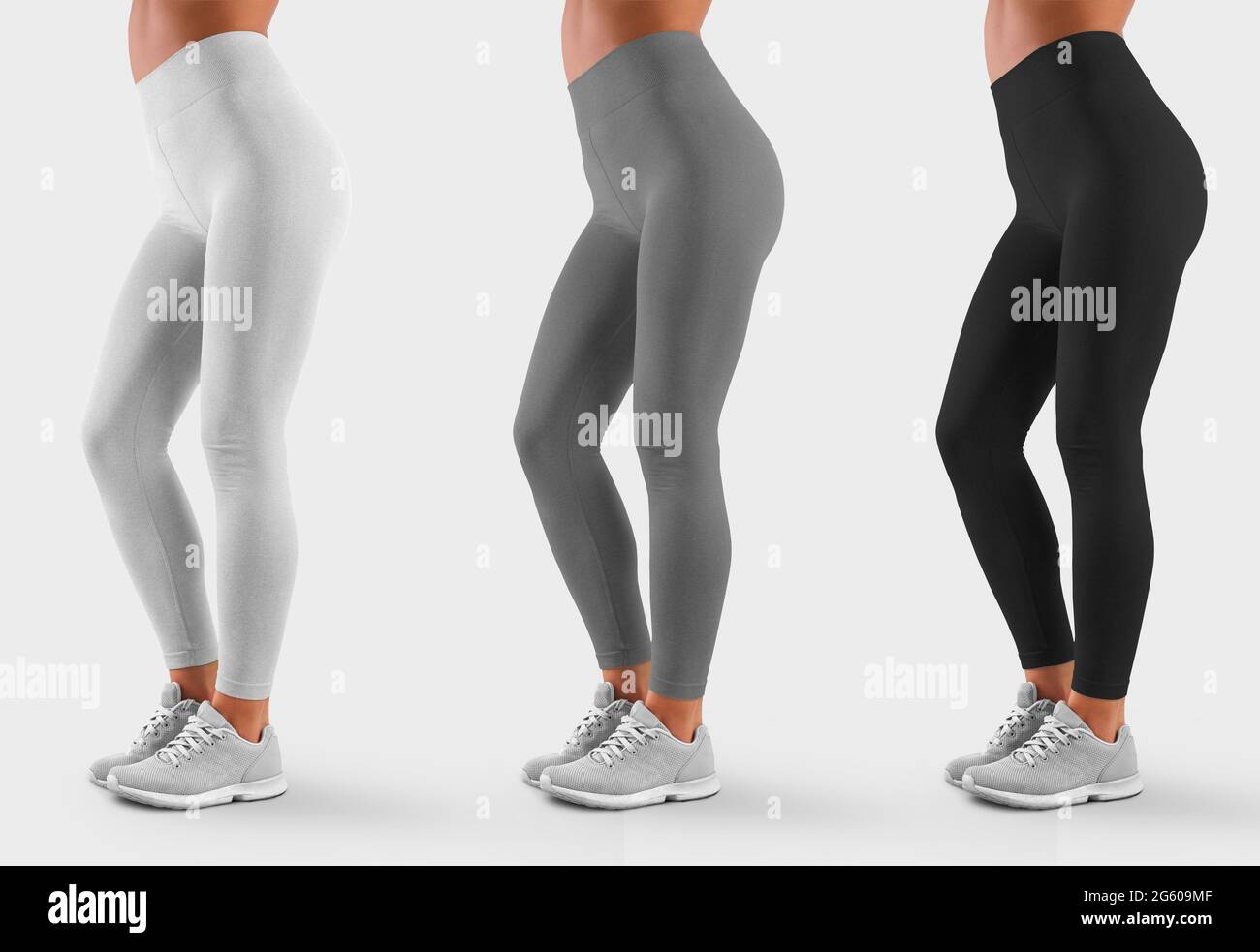 Template sweatpants tight-fitting on a sporty girl in sneakers, side view, for design presentation. Mockup of white, gray, black leggings on the model Stock Photo