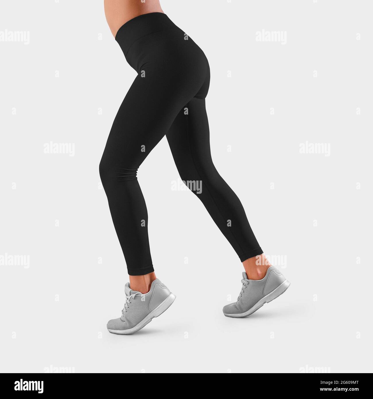 https://c8.alamy.com/comp/2G609MT/template-of-black-tight-fitting-sweatpants-on-the-taut-legs-of-a-girl-running-side-view-mockup-of-fitness-leggings-for-presentation-of-design-patt-2G609MT.jpg