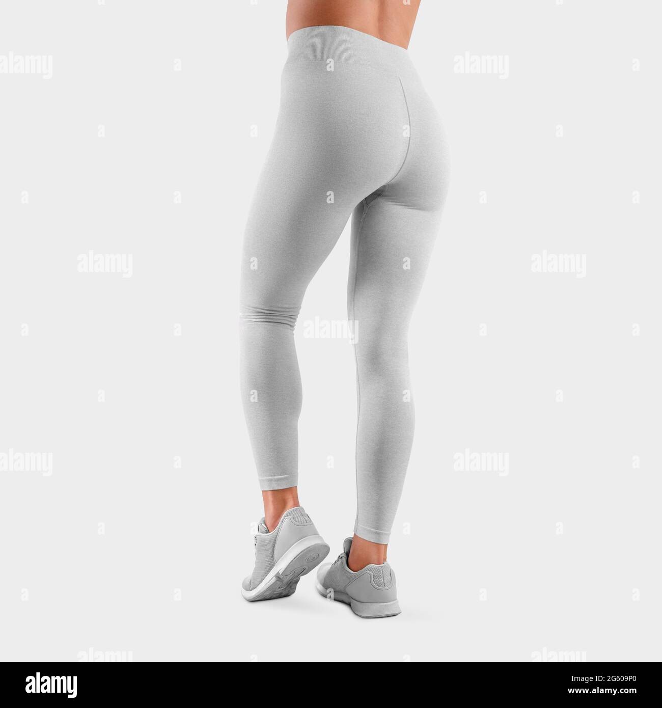 Template of stretch leggings on a fit girl, with a bent leg standing on a  toe, back view, white fabric stretch pants, isolated on the background.  Mock Stock Photo - Alamy