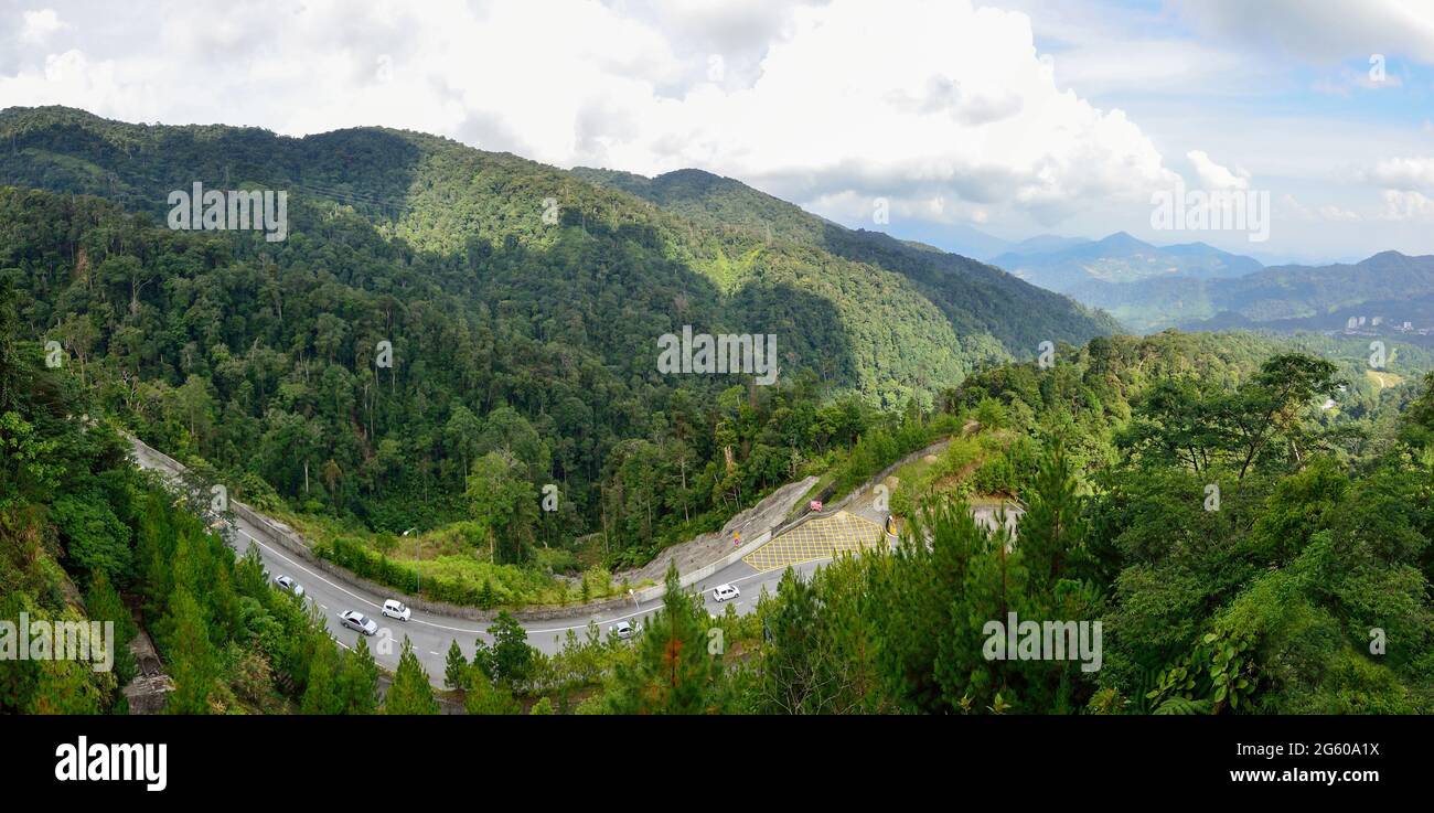Curve road up to the Genting Highlands Malaysia with green tree and sky at Bentong Pahang. Stock Photo