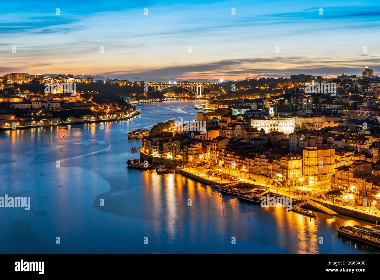 Skyline of the historic city of Porto with famous bridge at night in