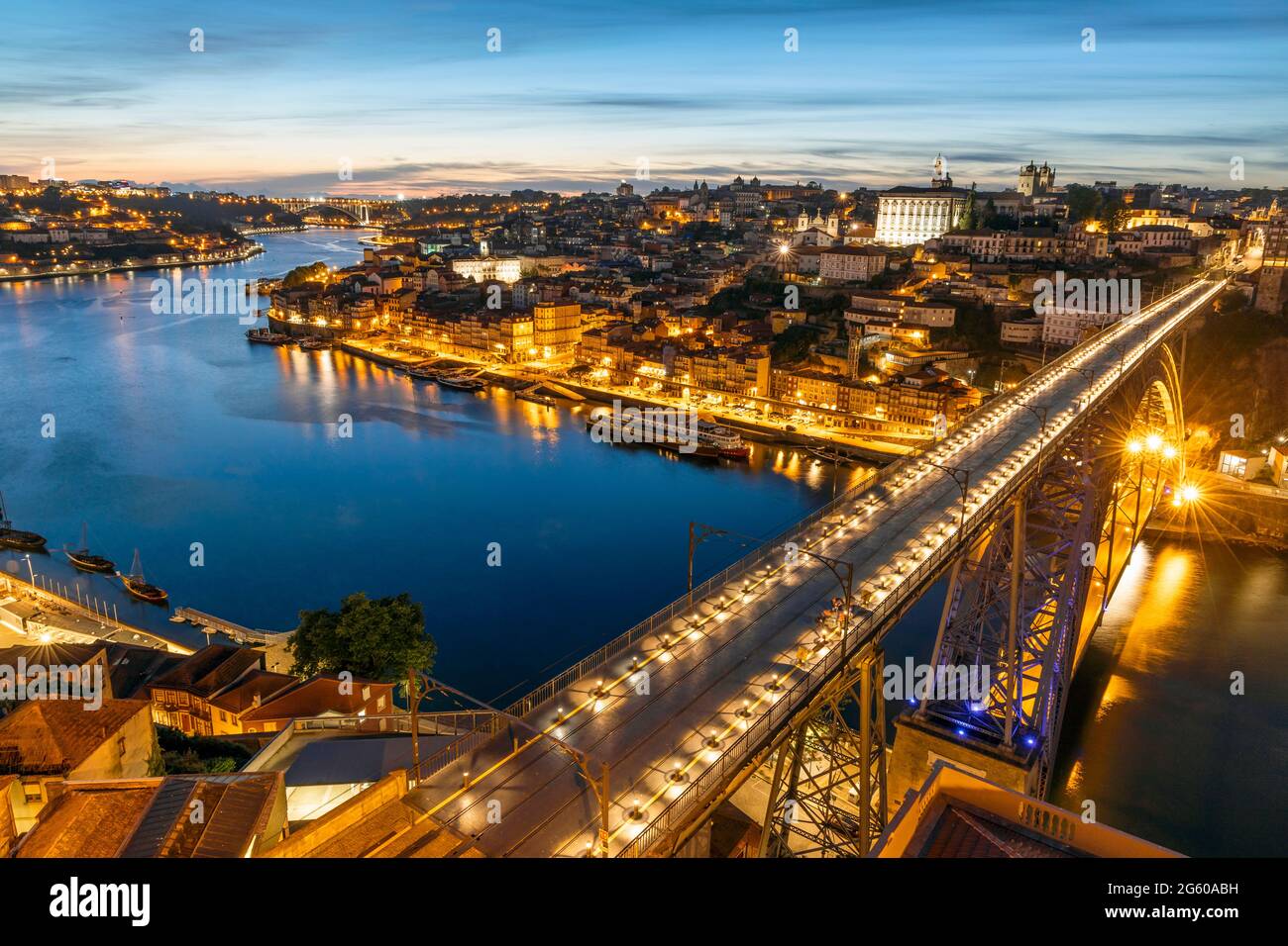 Skyline of the historic city of Porto with famous bridge at night in