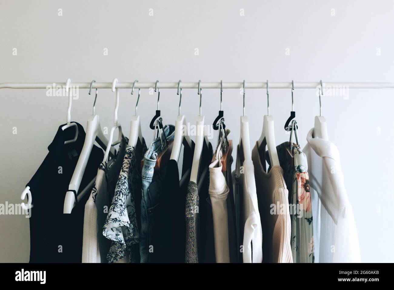 Colorful Wooden Cloth Hangers On Clothes Rail In White Wardrobe Stock  Photo, Picture and Royalty Free Image. Image 43816766.