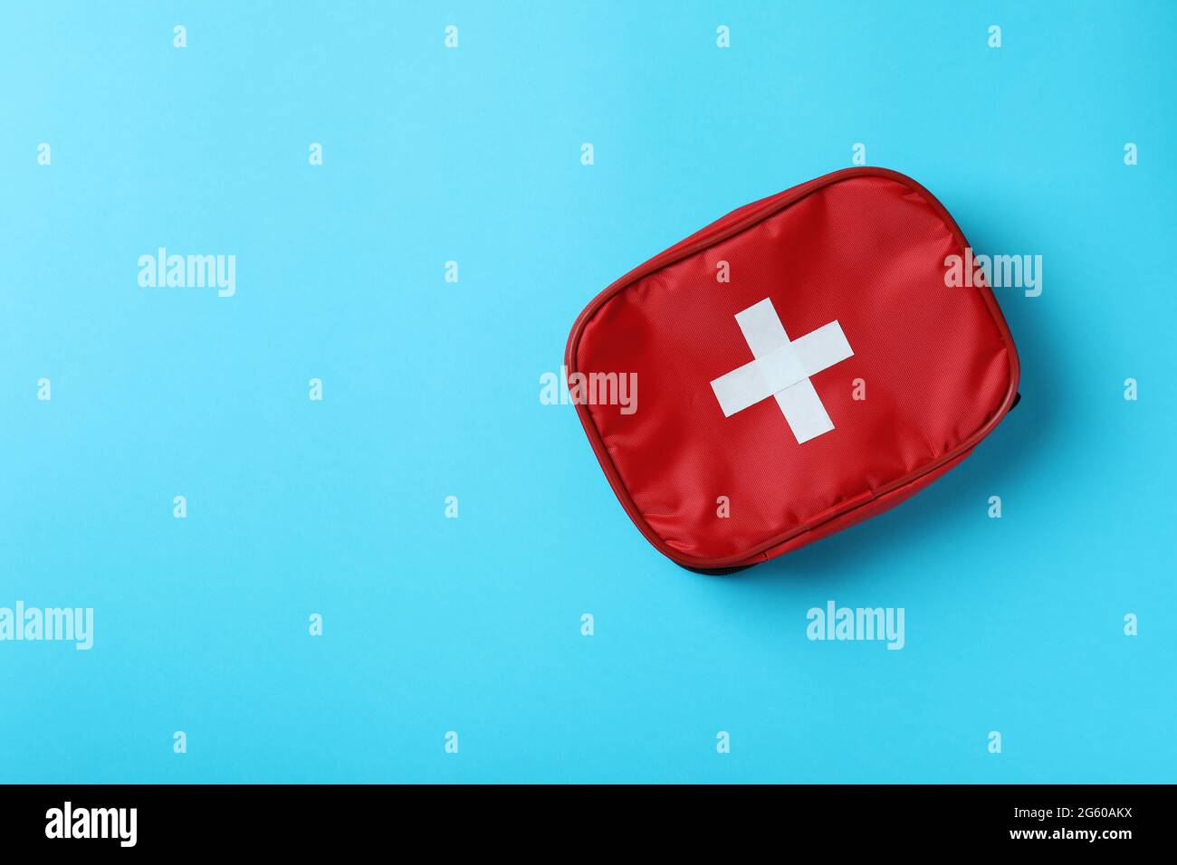 First aid medical kit on blue background Stock Photo - Alamy