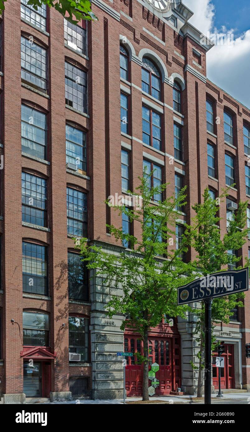 Vertical view of the Everett Mills building with Essex St. signage in
