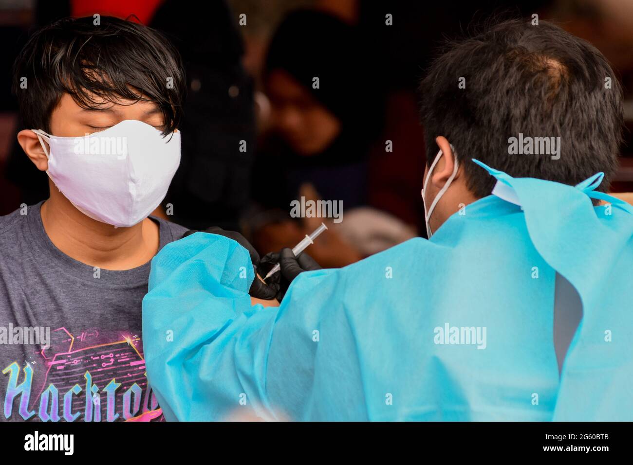 Indonesia 01st July 2021 A Man Receives A Shot Of The Sinovac Covid 19 Vaccine During A Mass Vaccination At Patriot Candrabaga Stadium In Bekasi Jawa Barat Indonesia Thursday Juli 1 2021 The