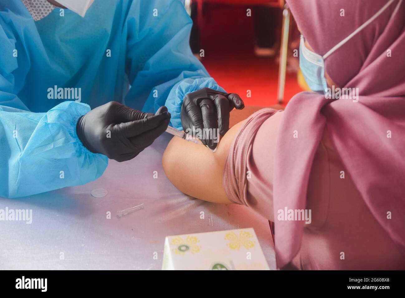 A Woman Receives A Shot Of The Sinovac Covid 19 Vaccine During A Mass Vaccination At Patriot Candrabaga Stadium In Bekasi Jawa Barat Indonesia Thursday Juli 1 2021 The World S Fourth Most Populous