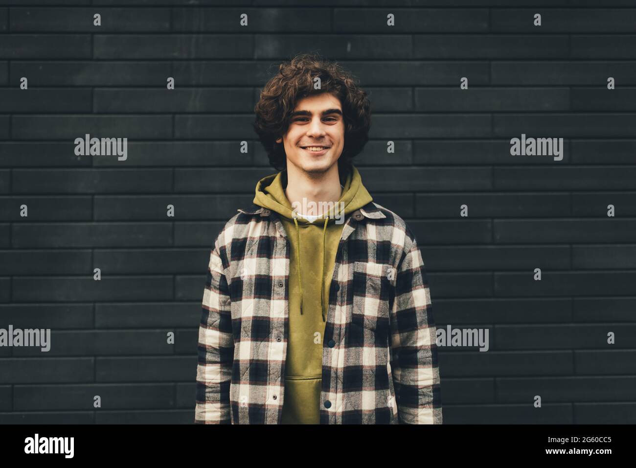Young curly man hi-res stock photography and images - Alamy