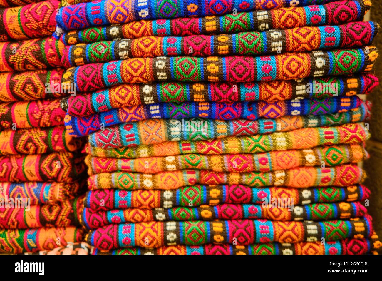 Folded colorful middle eastern carpets at bazaar Stock Photo