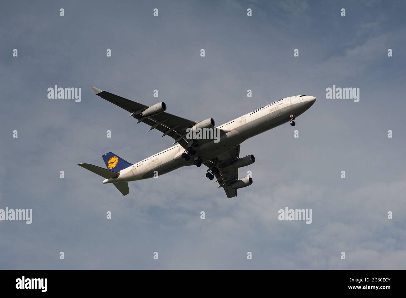 30.06.2021, Singapore, Republic of Singapore, Asia - A Lufthansa Airbus A340-300 passenger jet approaches Changi International Airport for landing. Stock Photo