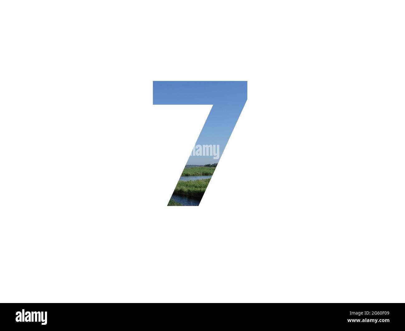 number 7 of the alphabet made with landscape with grass, stream and a blue sky Stock Photo