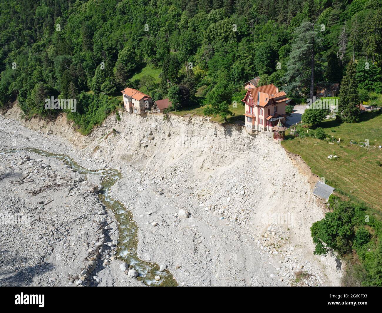 AERIAL VIEW. Homes left on the brink of collapse, high over the Vésubie River after Storm Alex hit the region on October 2020. Saint-Martin-Vésubie. Stock Photo