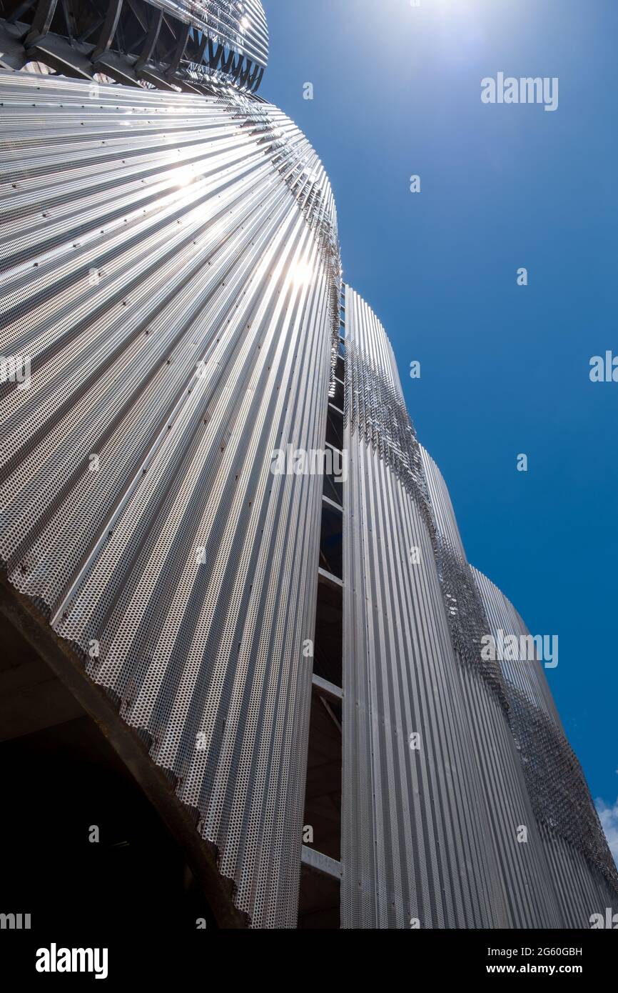 Perforated metal building facade and clear blue sky in Charlotte, North carolina, USA Stock Photo