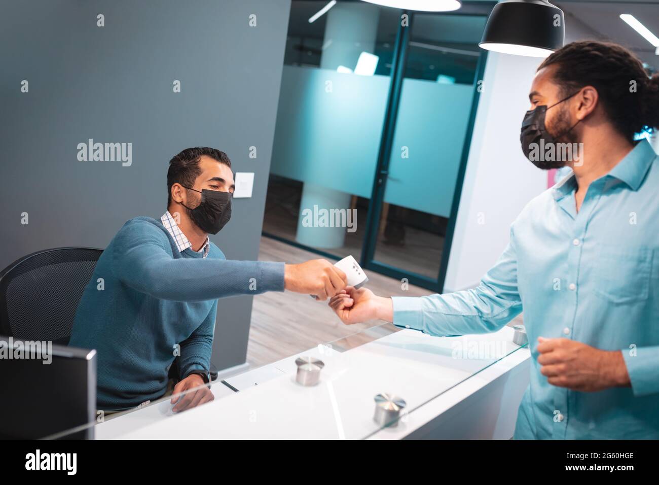 Wearing two face masks hi-res stock photography and images - Alamy