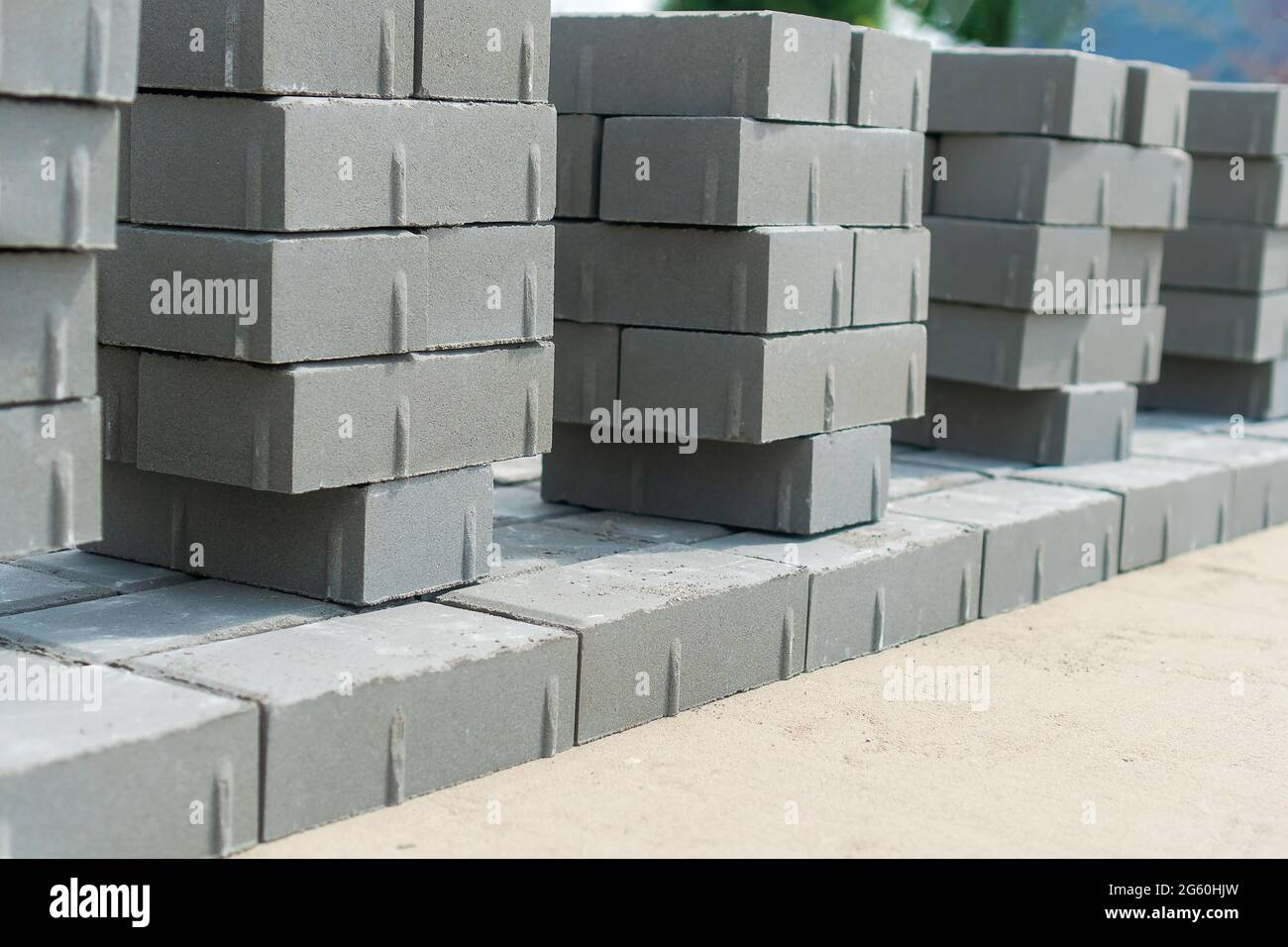 New paving slabs in rows in summer close-up. Laying of paving slabs ...