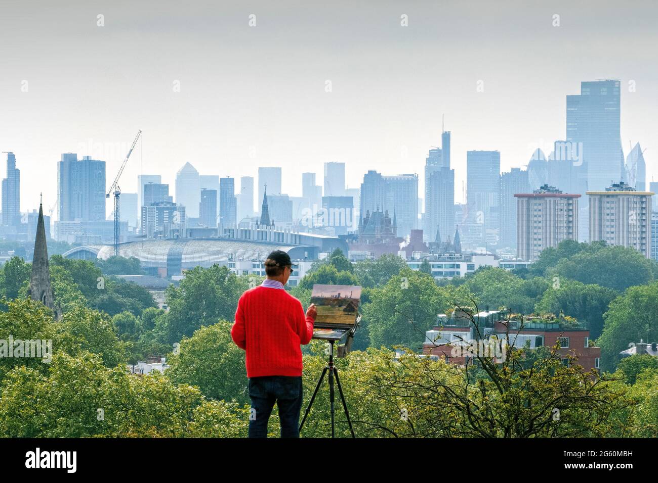 Artist painting the view from Primrose Hill Camden London UK Stock Photo