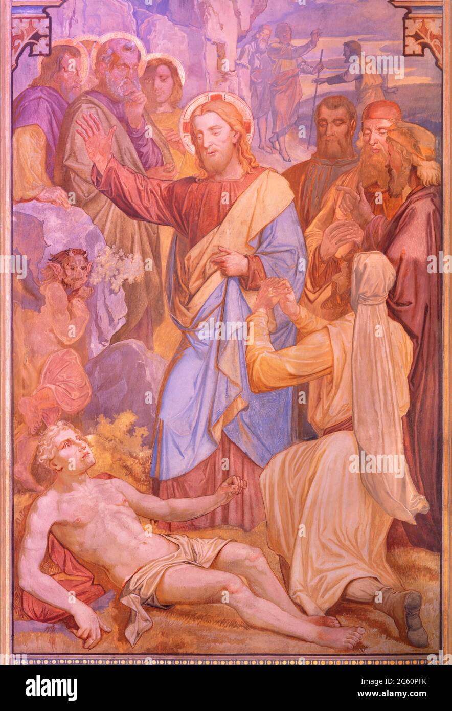 VIENNA, AUSTIRA - JUNI 24, 2021: The fresco Jesus exorcising a boy possessed by a demon in the Votivkirche church by brothers Carl and Franz Jobst Stock Photo