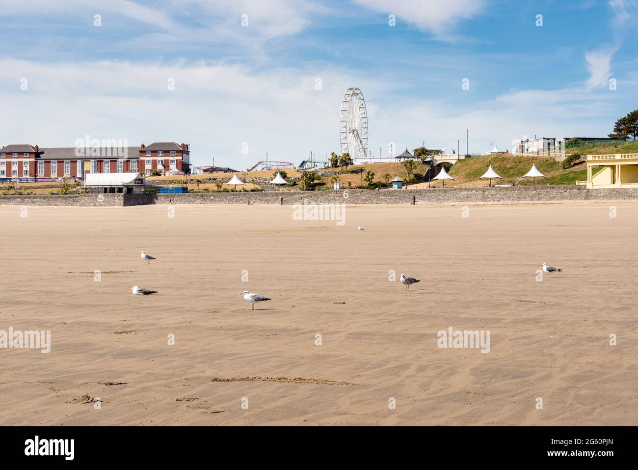 Due to the Covid-19 lockdown the beach at Barry Island is almost deserted despite it being a sunny spring bank holiday Stock Photo