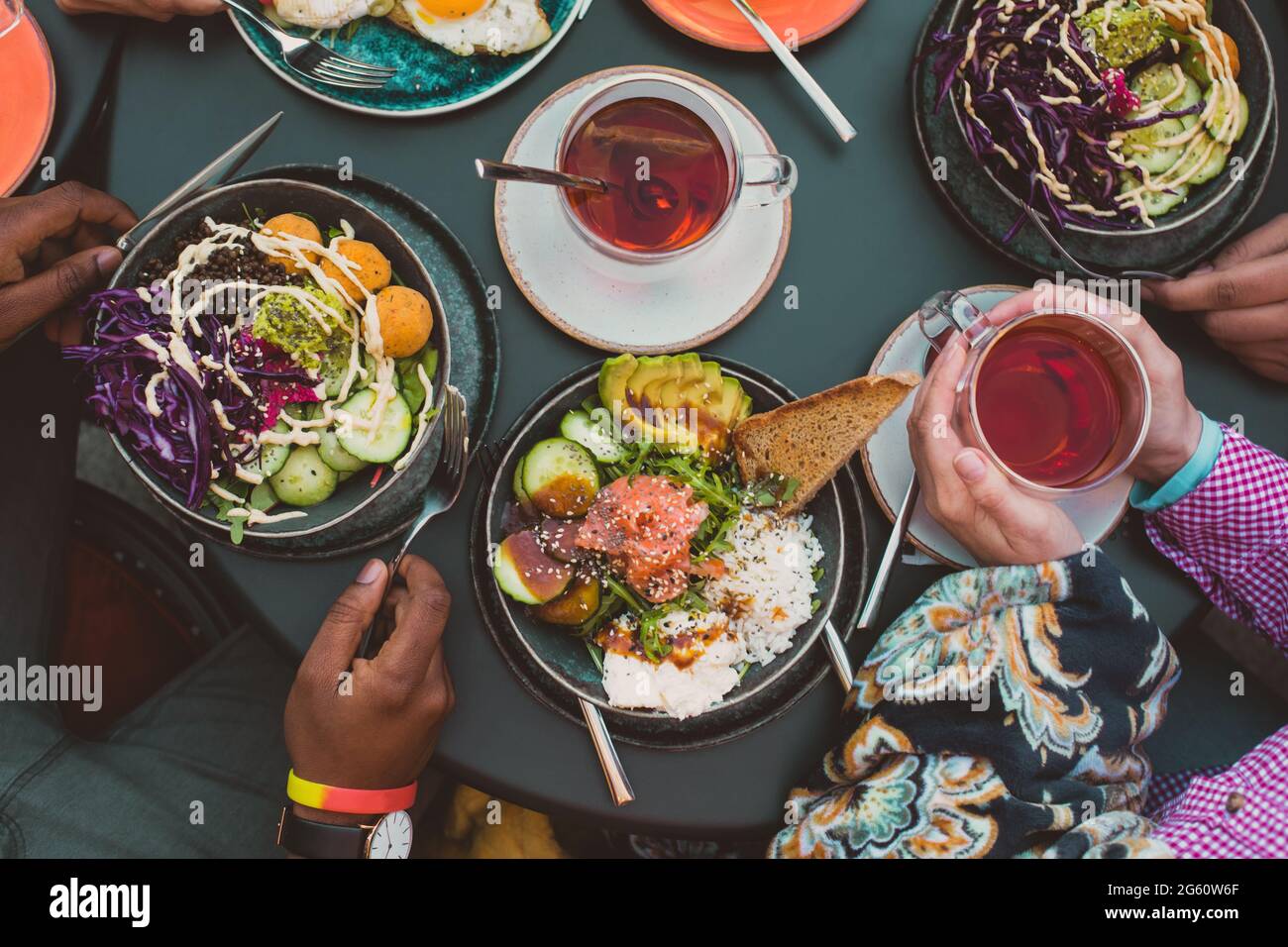 Top view cafe table with bowls of salad Stock Photo - Alamy