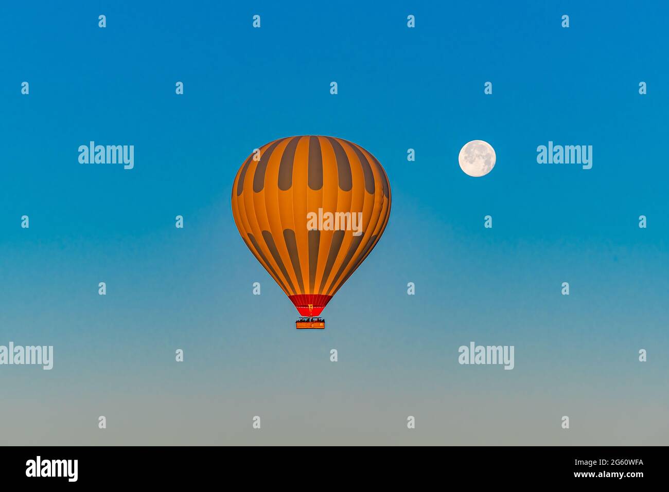 Illustration of air balloon flying in a blue sky Stock Photo - Alamy