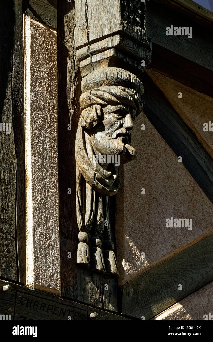 France, Bas Rhin, Molsheim, Church street (Rue de l'Eglise), half-timbered house dated 16th century, carved beam, man's head Stock Photo
