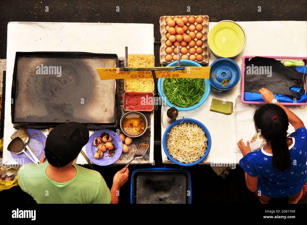 Filipino chef vendor cooking local street food philippine style at