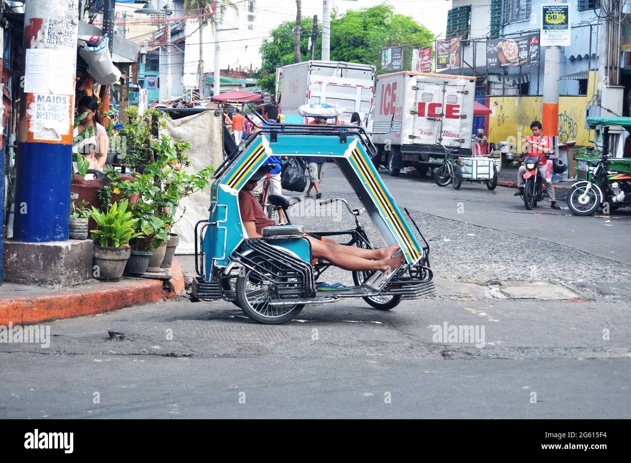 Classic antique vintage retro rickshaw trishaw bicycle for filipino people and foreign travelers passenger journey visit tour Intramuros square at May Stock Photo