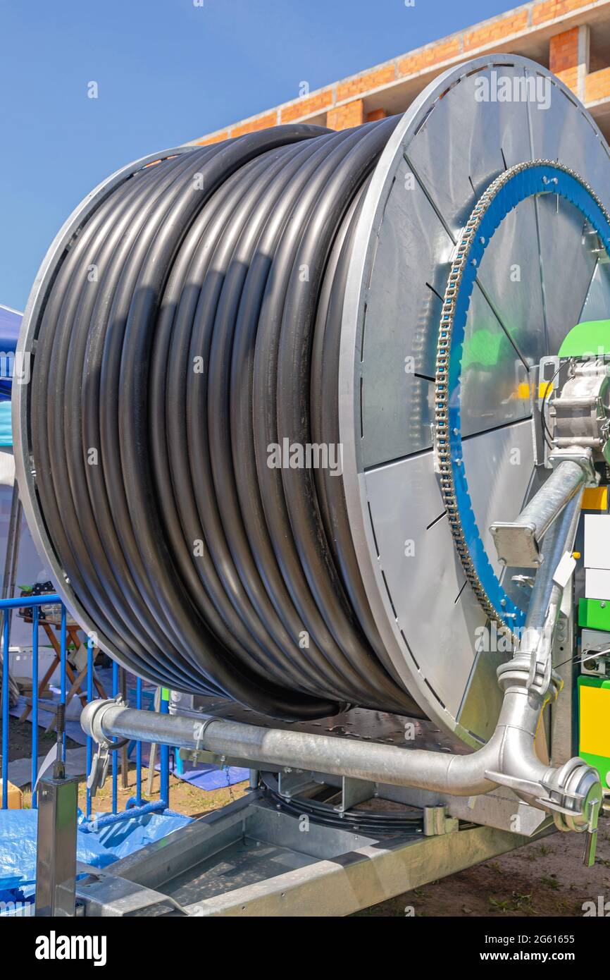 Black Plastic Water Hose at Reel Spool for Agriculture Irrigation Stock Photo Alamy