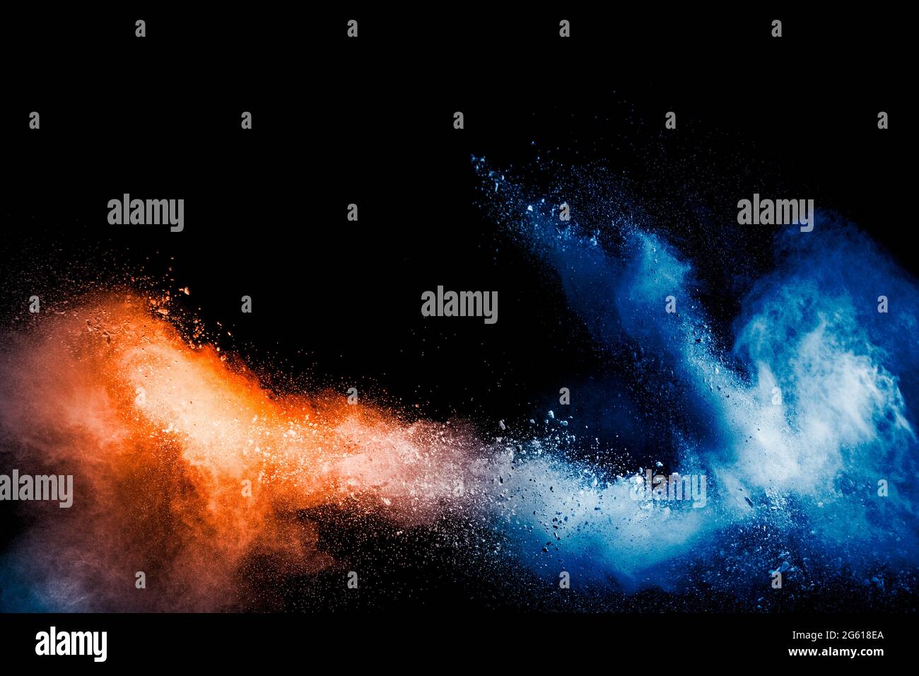 Orange blue color powder explosion on black background. Stock Photo