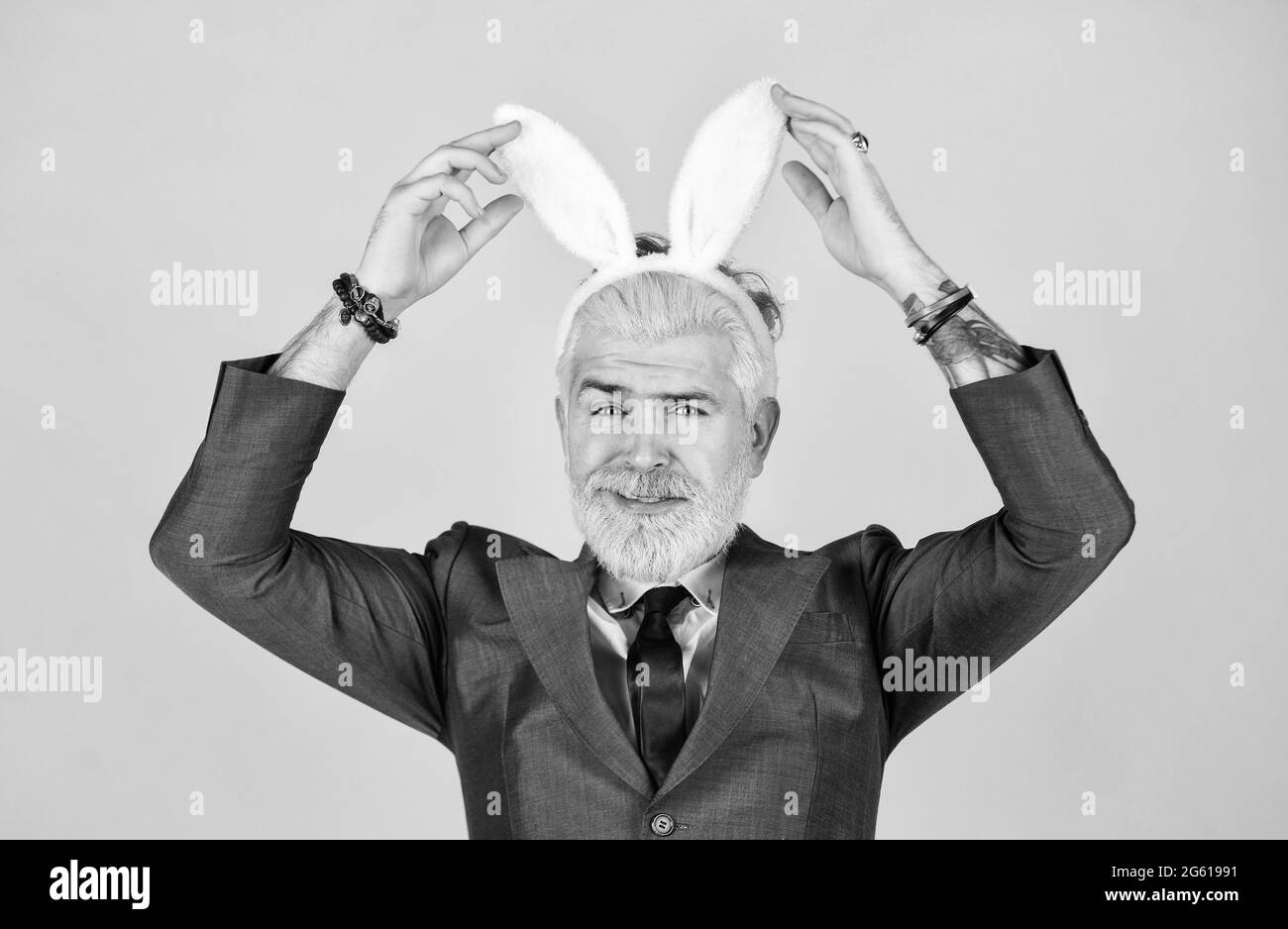 Having fun. Bearded man bunny ears on head. Funny boss. Bunny Easter ...