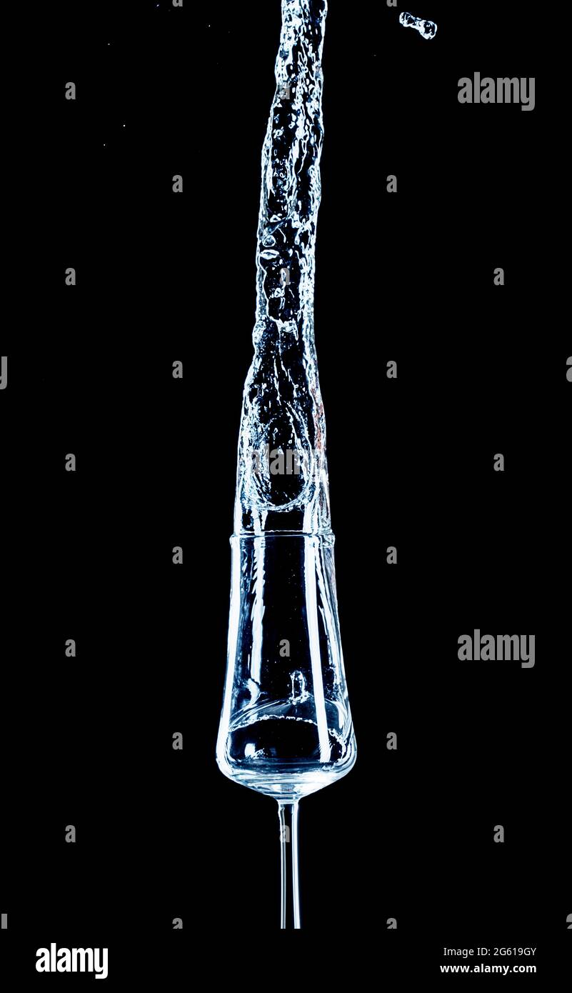 Water splash with inverted glass and black background Stock Photo - Alamy
